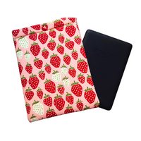 Kindle sleeve with snap to protect Kindle e-readers made with a pink back ground with red and white strawberries.